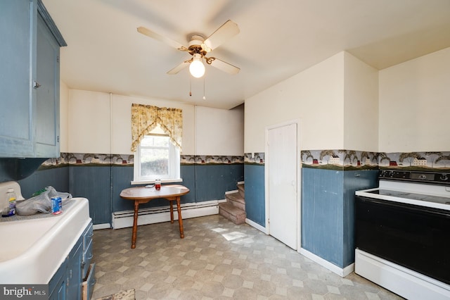 kitchen featuring blue cabinetry, ceiling fan, a baseboard radiator, and white range with electric stovetop