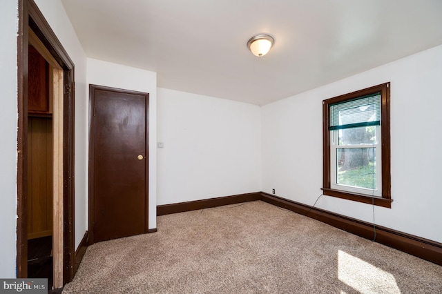 unfurnished room with carpet flooring