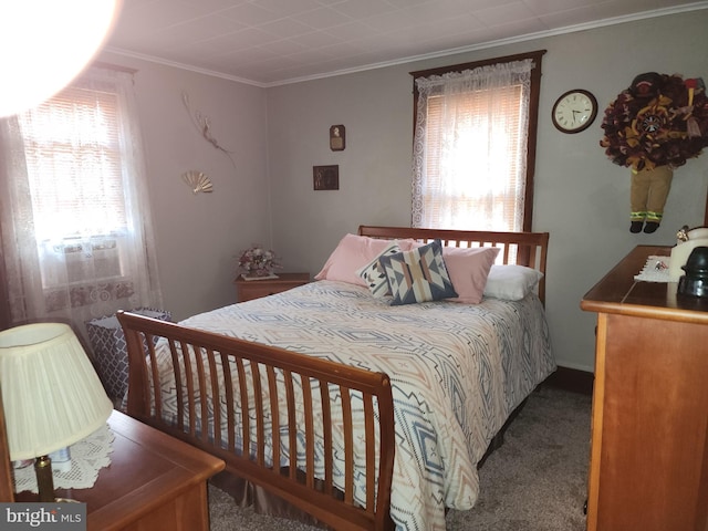 carpeted bedroom with ornamental molding