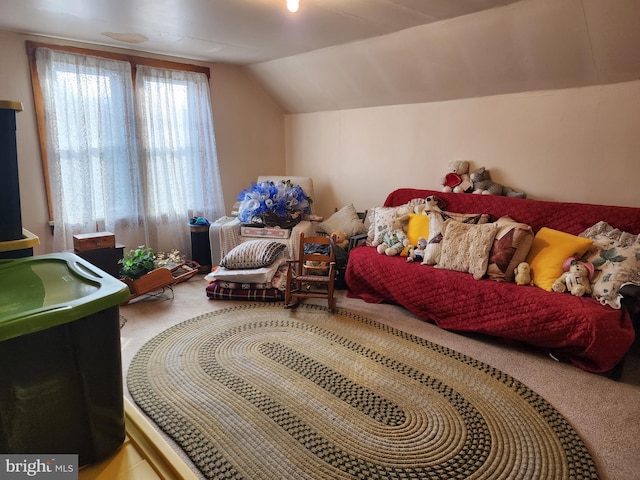 bedroom with carpet flooring and lofted ceiling