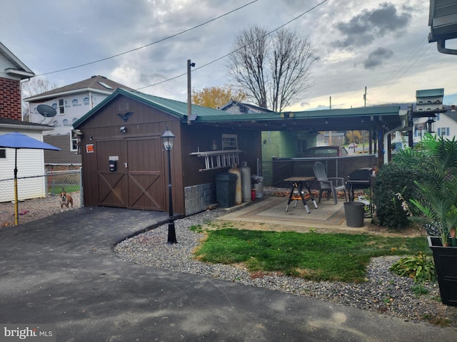 exterior space with a patio and a storage unit