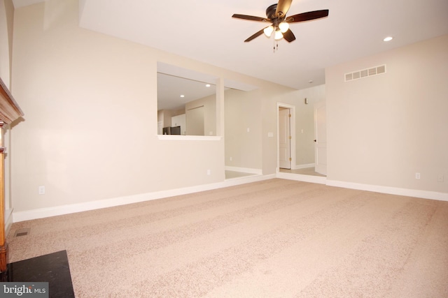 unfurnished room with carpet and ceiling fan