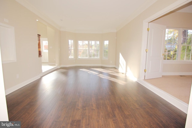 unfurnished room with hardwood / wood-style floors and ornamental molding