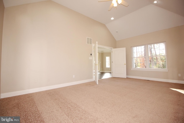 interior space with ceiling fan, light colored carpet, and high vaulted ceiling