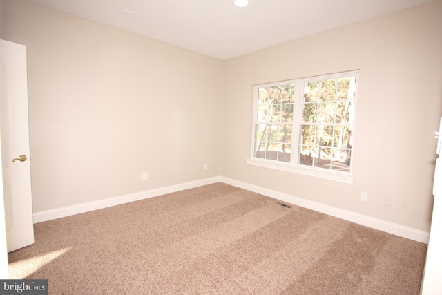 view of carpeted spare room