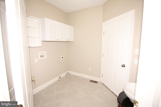 washroom featuring washer hookup, hookup for an electric dryer, cabinets, and light tile patterned floors