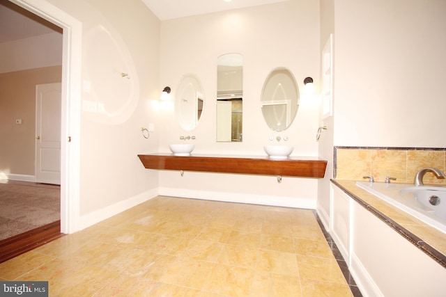 bathroom with a bathtub and vanity