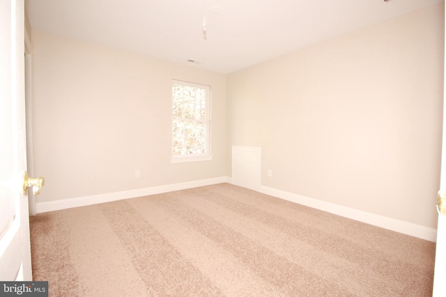 unfurnished room featuring carpet flooring