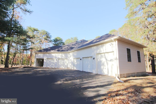 view of side of home with a garage