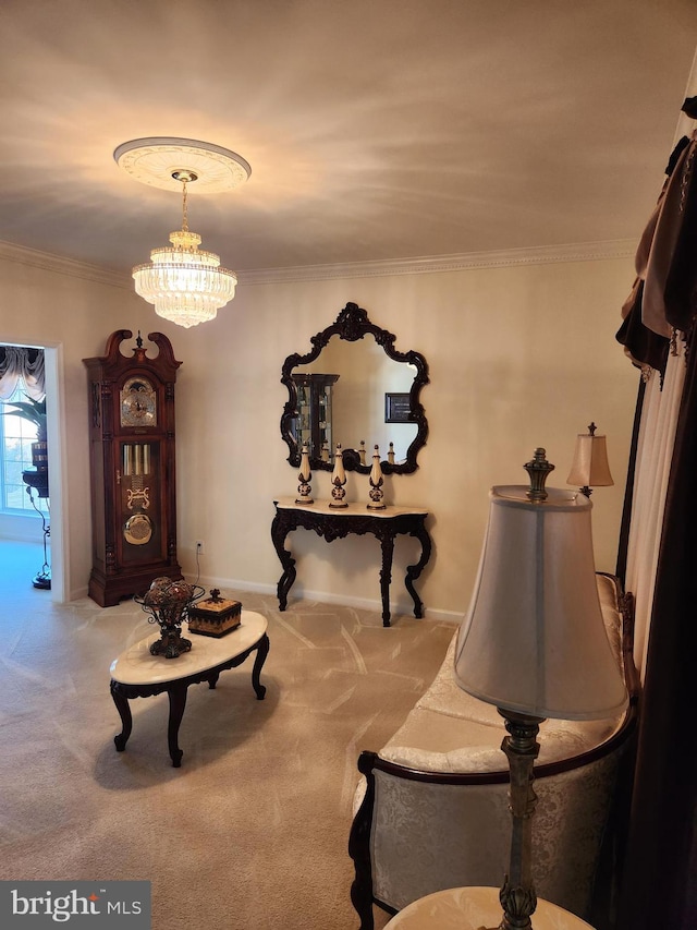 sitting room with ornamental molding, carpet, and a notable chandelier