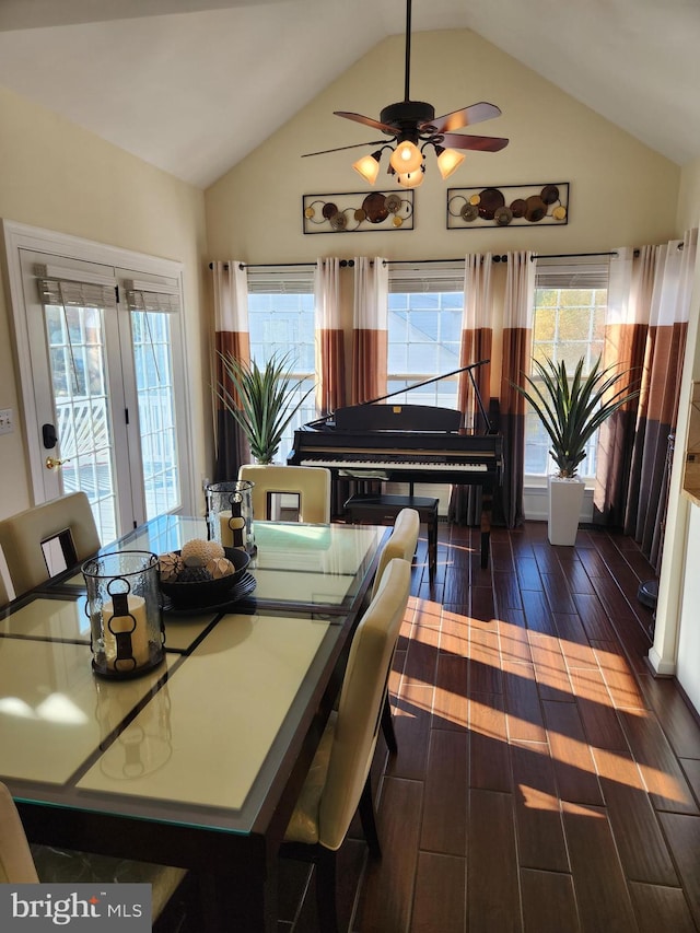 dining area with dark wood-type flooring, lofted ceiling, and ceiling fan