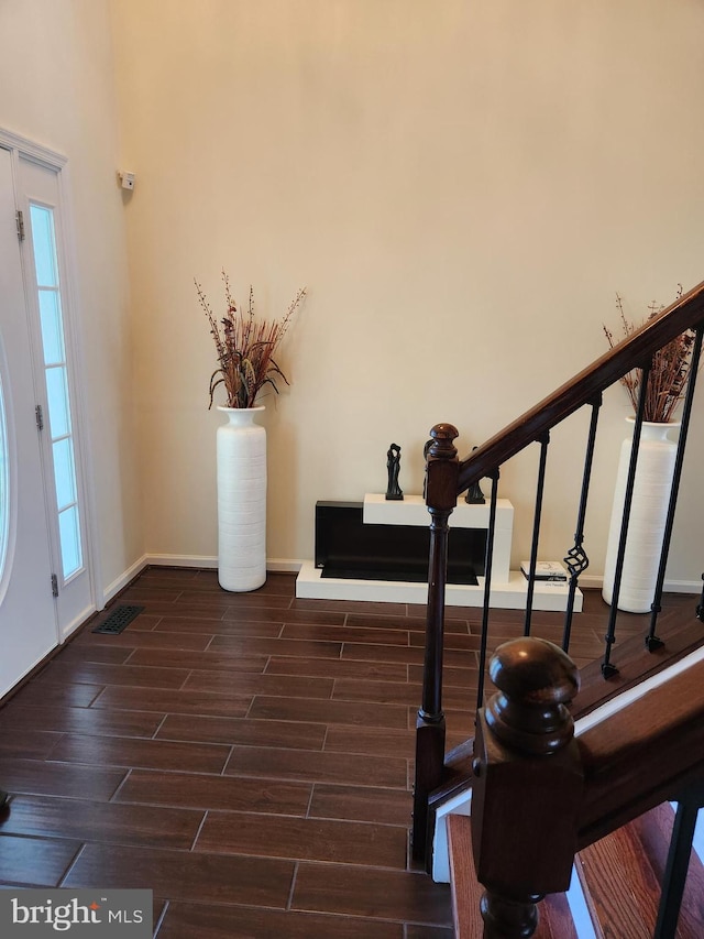 entryway featuring dark wood-type flooring