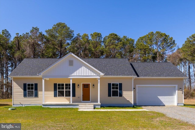 view of front of house featuring a porch, a garage, driveway, roof with shingles, and a front lawn