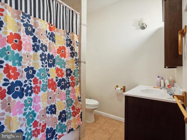 bathroom featuring vanity, tile patterned flooring, toilet, and a shower with curtain