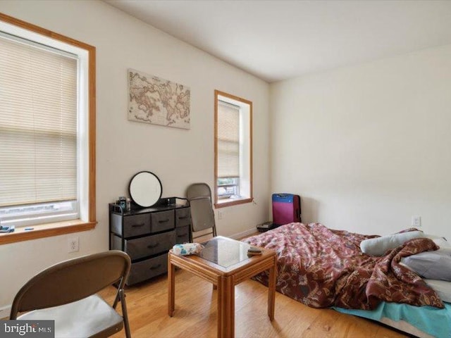 bedroom with light hardwood / wood-style flooring