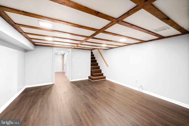 basement featuring dark hardwood / wood-style floors