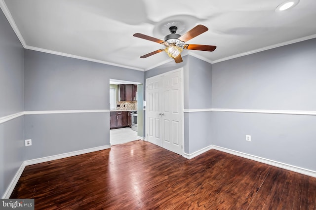 spare room featuring ceiling fan, light hardwood / wood-style flooring, and crown molding