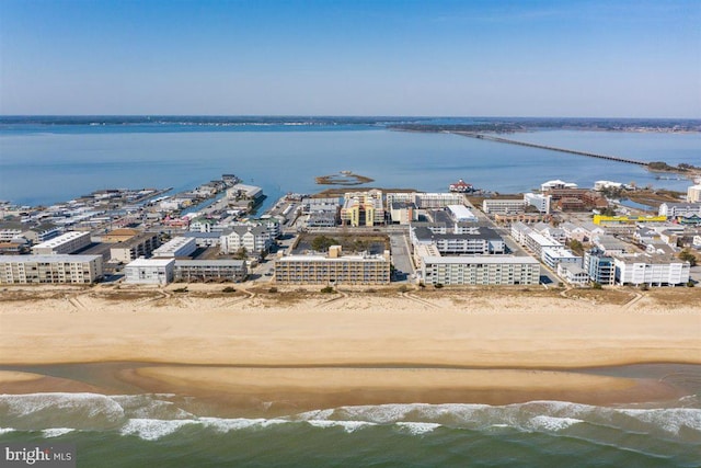 bird's eye view featuring a water view and a view of the beach