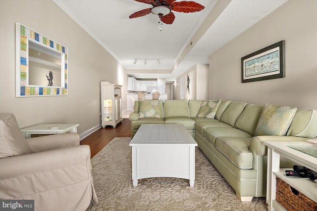 living room featuring ceiling fan, wood-type flooring, crown molding, and track lighting