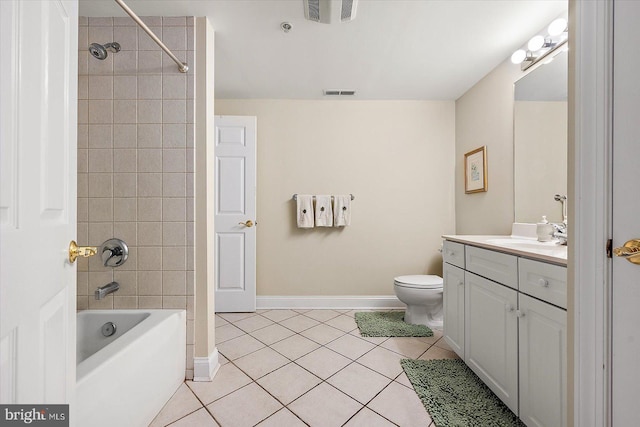 full bathroom with tile patterned flooring, vanity, toilet, and tiled shower / bath