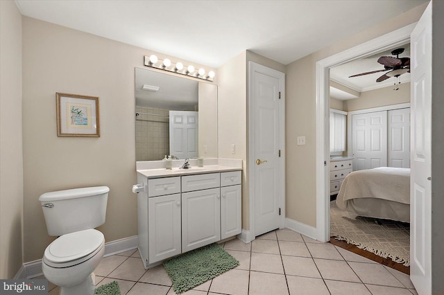 bathroom with tile patterned floors, ceiling fan, toilet, and vanity