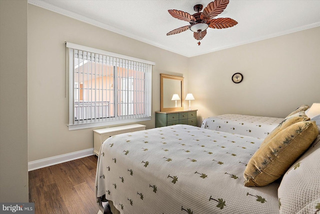 bedroom with ceiling fan, dark hardwood / wood-style flooring, and ornamental molding