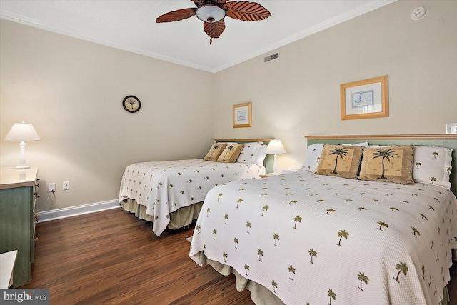 bedroom with dark hardwood / wood-style floors, ceiling fan, and crown molding