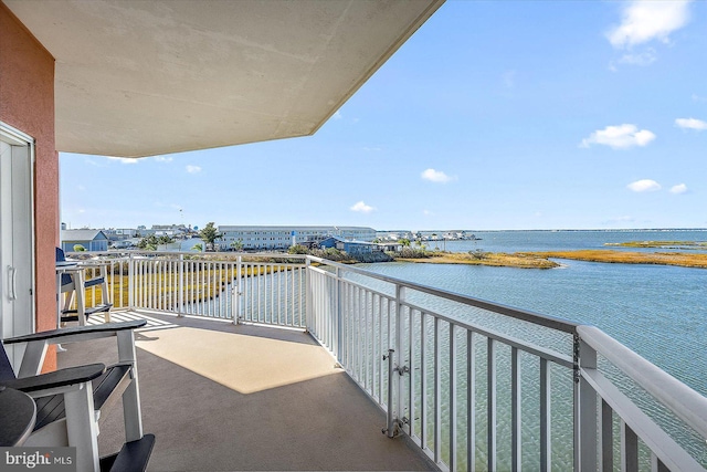 balcony featuring a water view