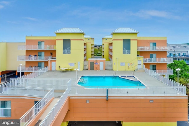 view of swimming pool featuring a patio