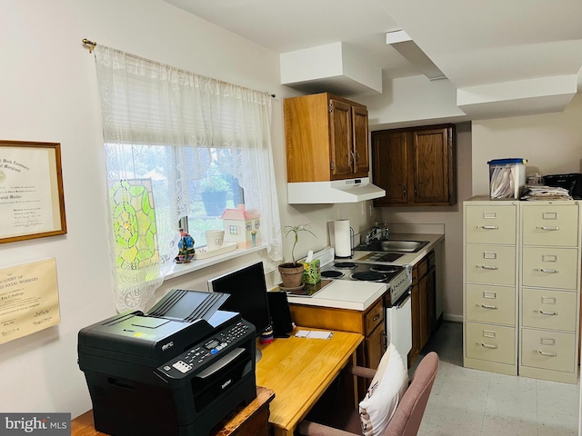 kitchen with electric range and sink