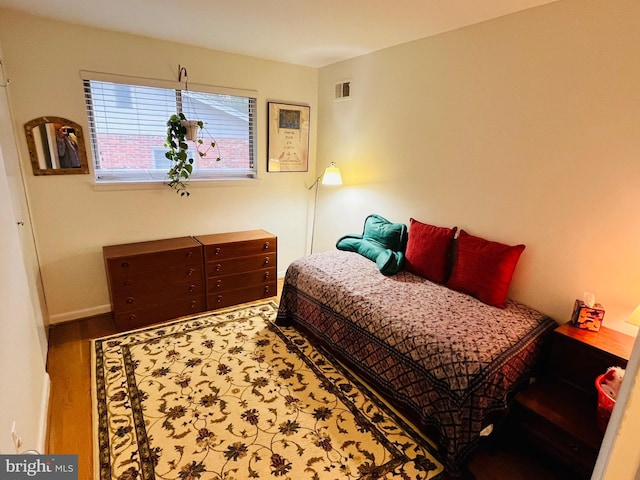 bedroom featuring hardwood / wood-style floors