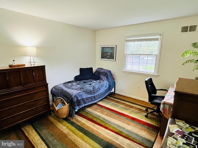 bedroom featuring hardwood / wood-style floors