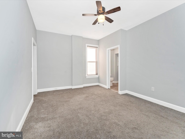 carpeted empty room featuring ceiling fan