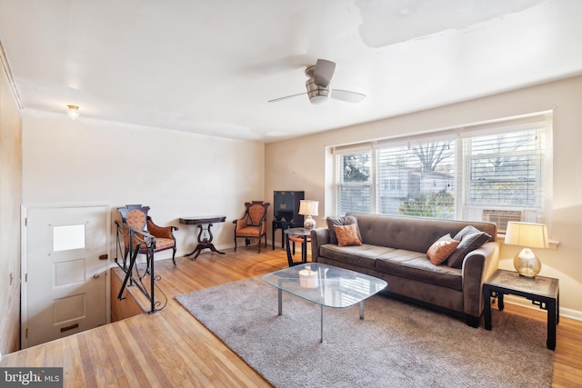 living room with ceiling fan, hardwood / wood-style floors, and cooling unit