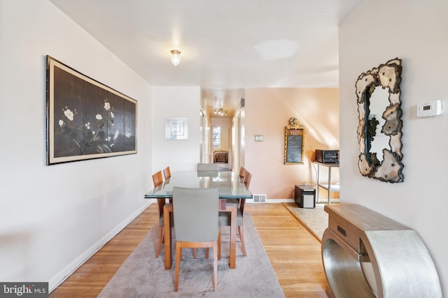 dining space featuring light hardwood / wood-style floors