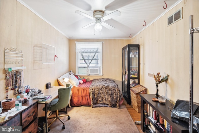 bedroom with ceiling fan, cooling unit, and ornamental molding