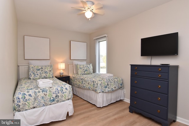 bedroom featuring ceiling fan and light hardwood / wood-style flooring