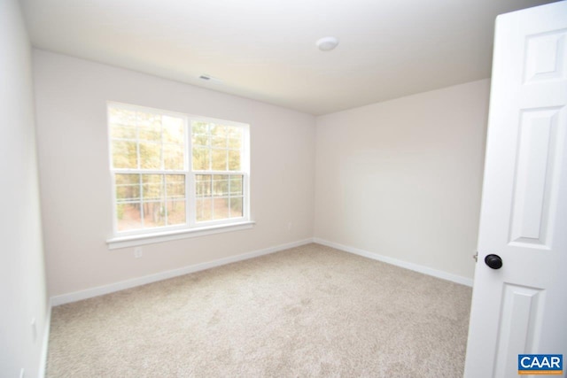 spare room with carpet floors