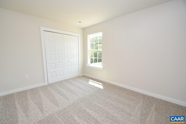 unfurnished bedroom featuring carpet floors