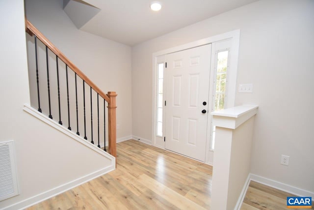 entryway with light hardwood / wood-style flooring