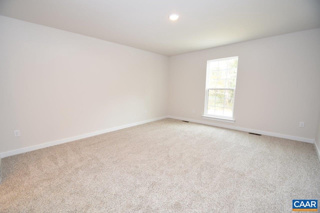 empty room featuring carpet flooring