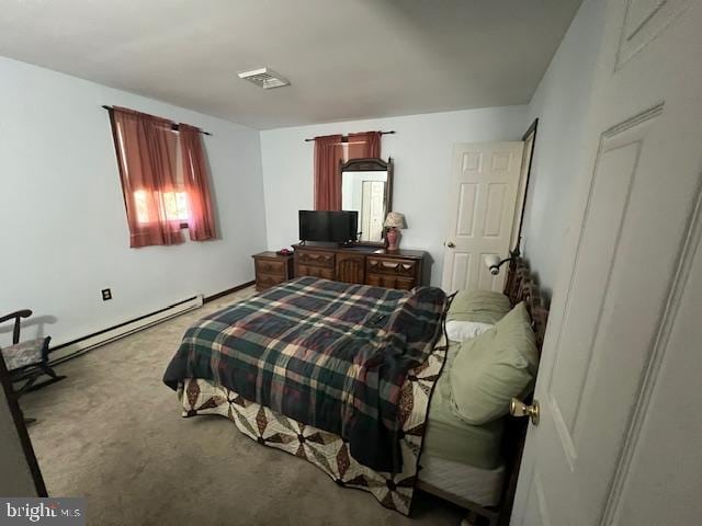 carpeted bedroom featuring a baseboard radiator