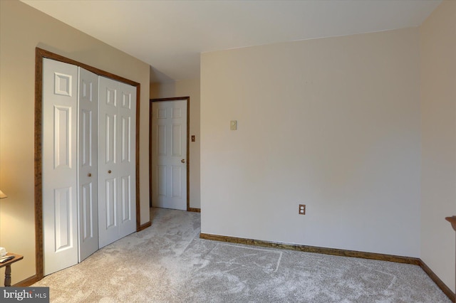 unfurnished bedroom featuring light carpet