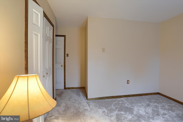 unfurnished room with light carpet