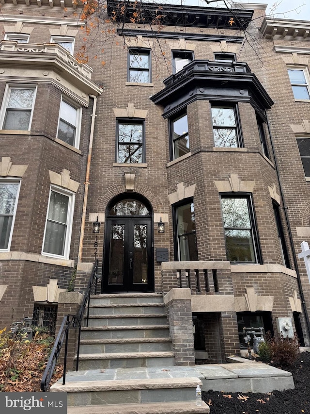 property entrance featuring french doors