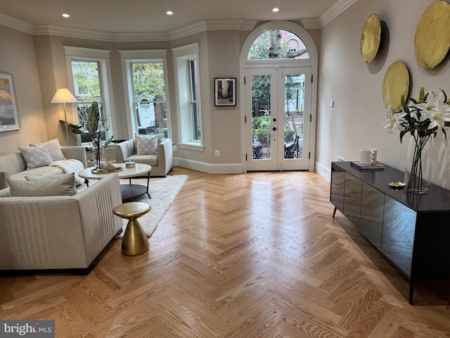 living room with light parquet floors, crown molding, and french doors