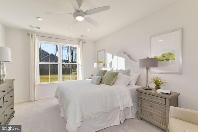 bedroom with light carpet and ceiling fan