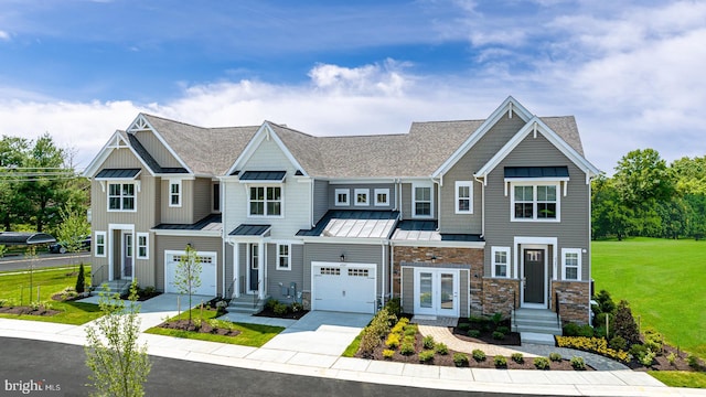 view of front of house with a garage and a front lawn