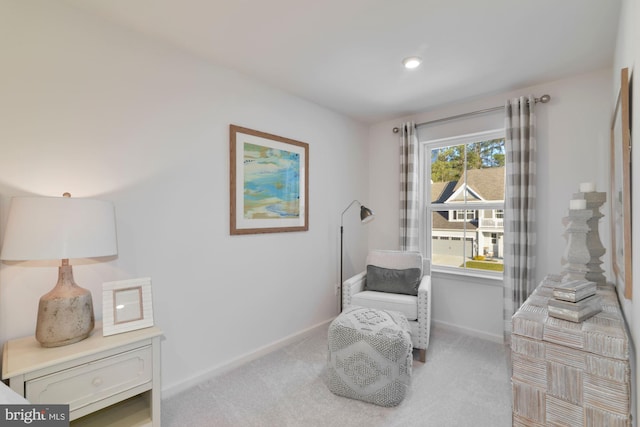 living area featuring carpet floors