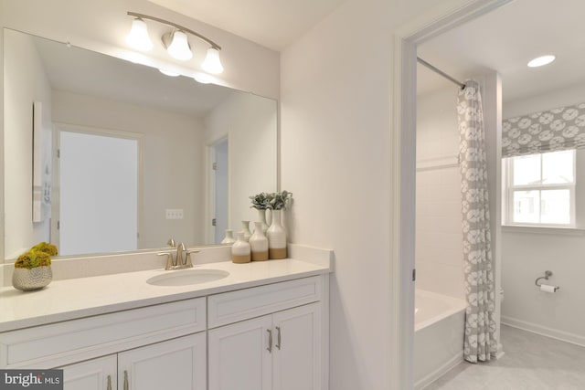 bathroom with vanity and shower / bath combo with shower curtain